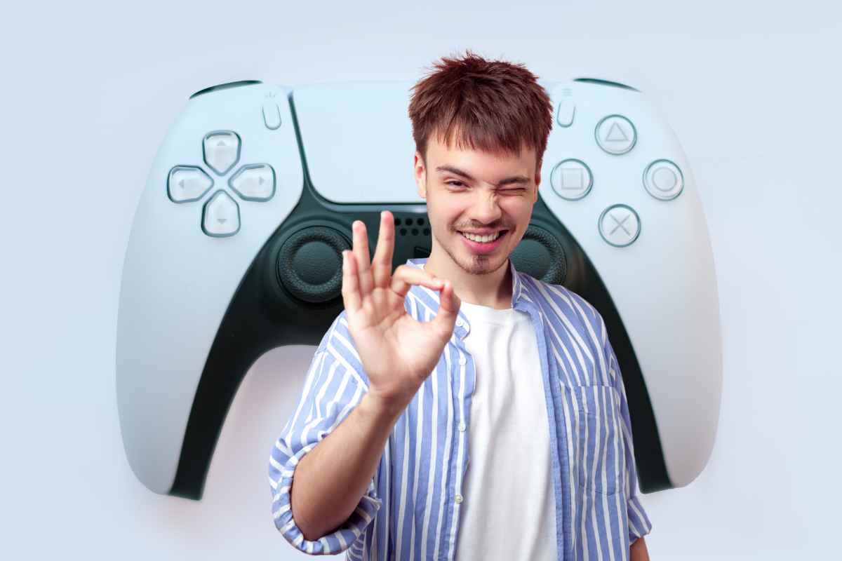 uomo che fa il gesto ok e controller ps5