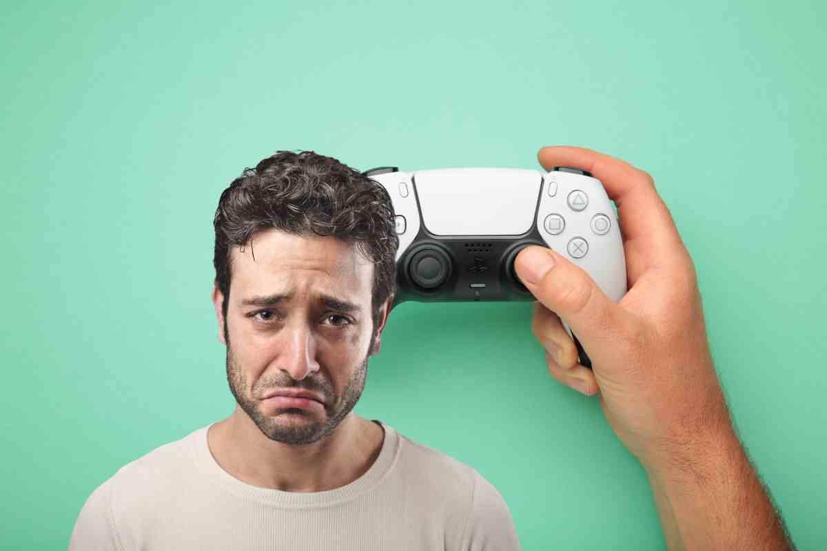 uomo triste con controller