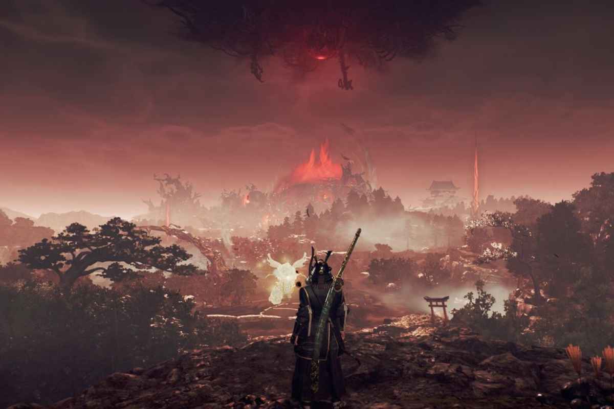 scena di nioh 3 con sole rosso e paesaggio lugobre