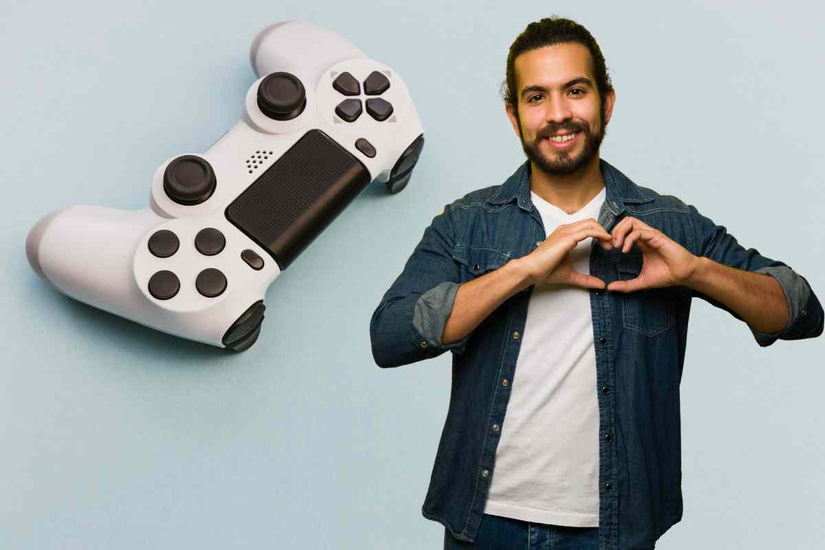 uomo che fa i lgesto del cuore e pad ps4