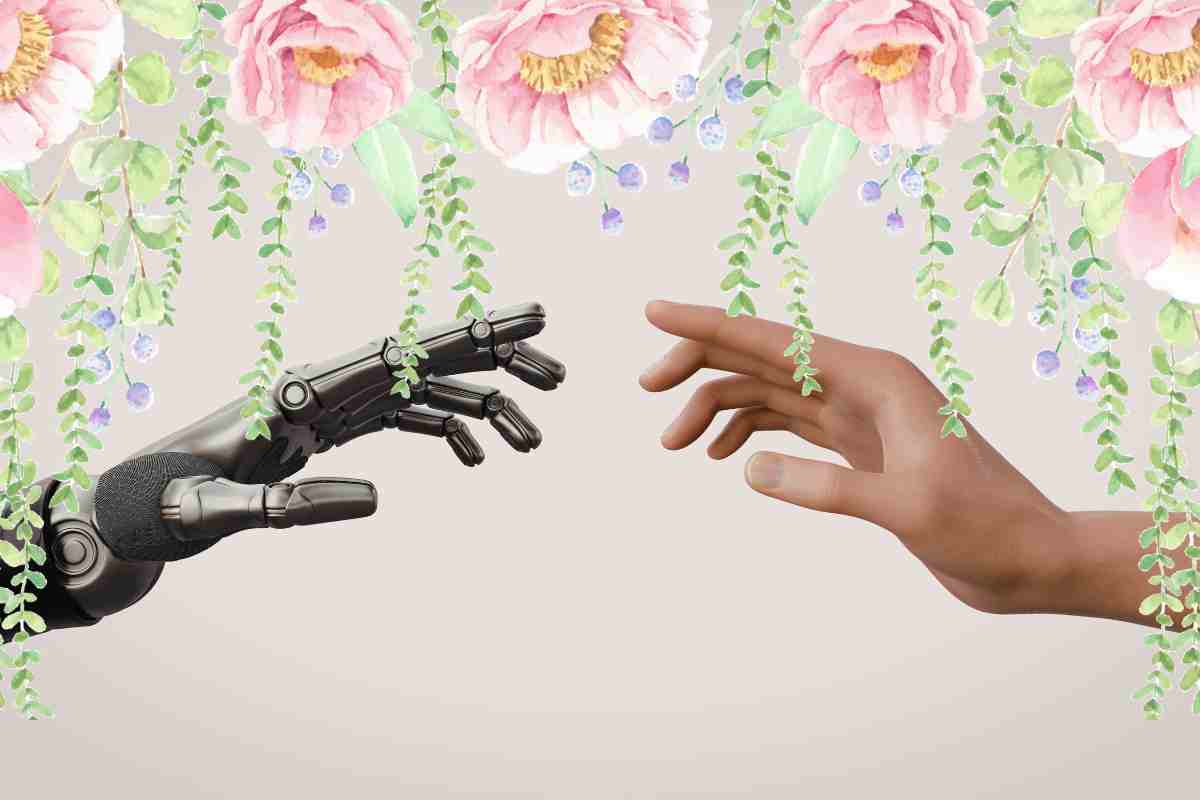mano umana e robot con fiori